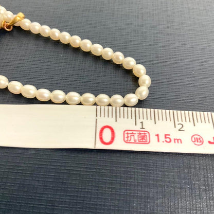 TASAKI baby pearl necklace with K18 gold pendant and Akoya pearls displayed with original box