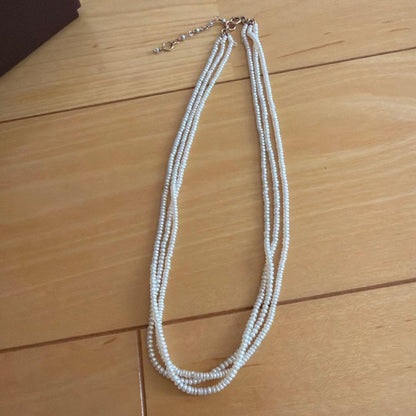 Baby Pearl Three-Strand Necklace with three white pearls on a 40 cm chain