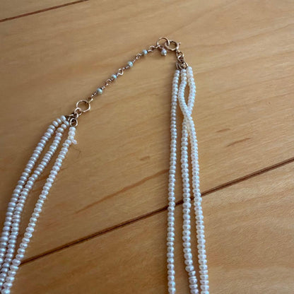 Baby Pearl Three-Strand Necklace with three white pearls on a 40 cm chain