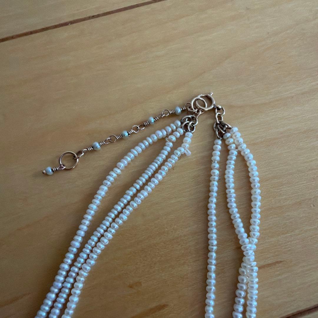 Baby Pearl Three-Strand Necklace with three white pearls on a 40 cm chain