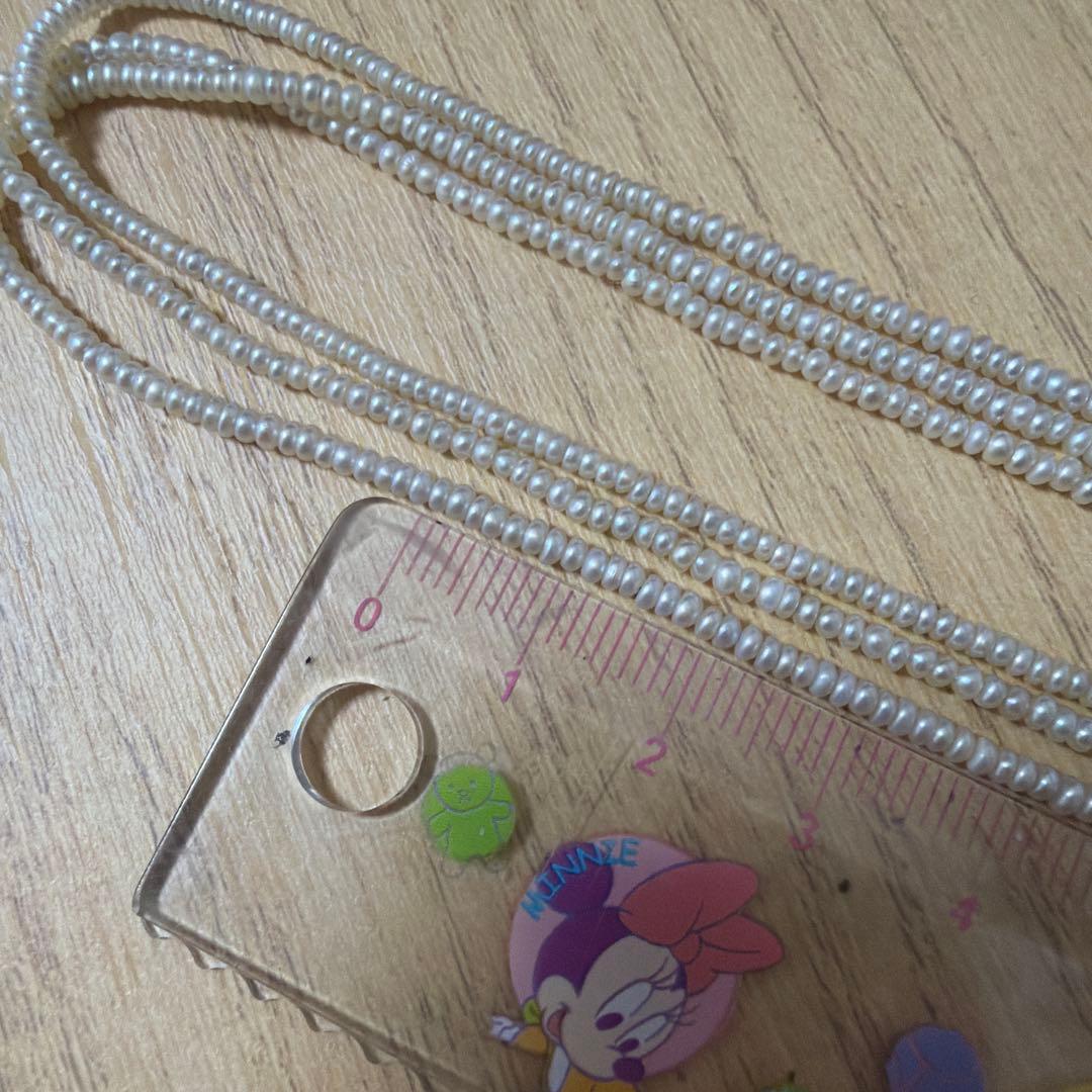 Baby Pearl Three-Strand Necklace with three white pearls on a 40 cm chain