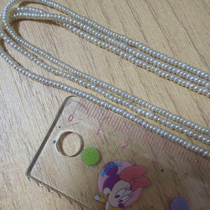 Baby Pearl Three-Strand Necklace with three white pearls on a 40 cm chain