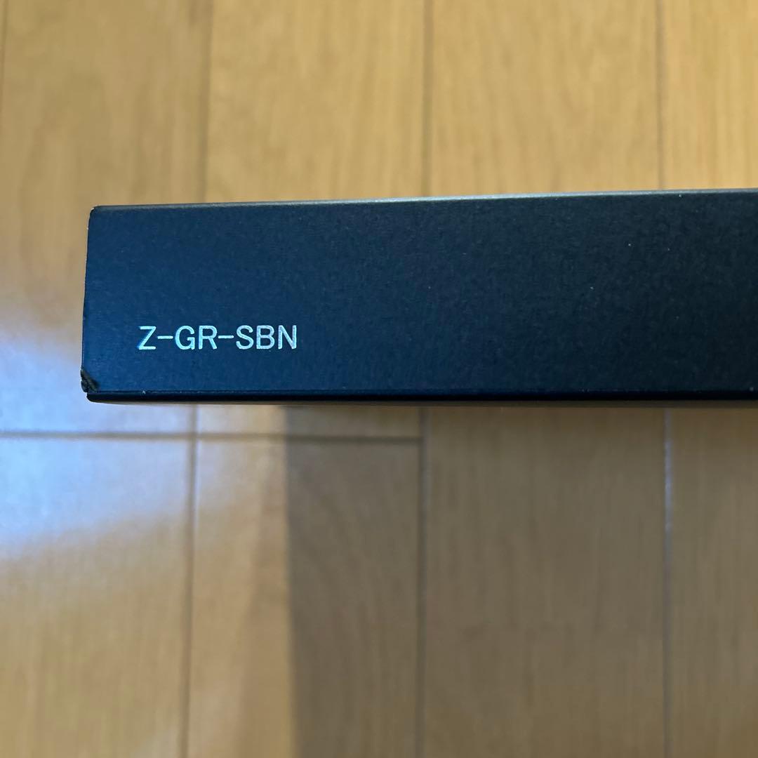 PILOT Z-GR-SBN black ballpoint pen alongside its black pen case with a damaged box