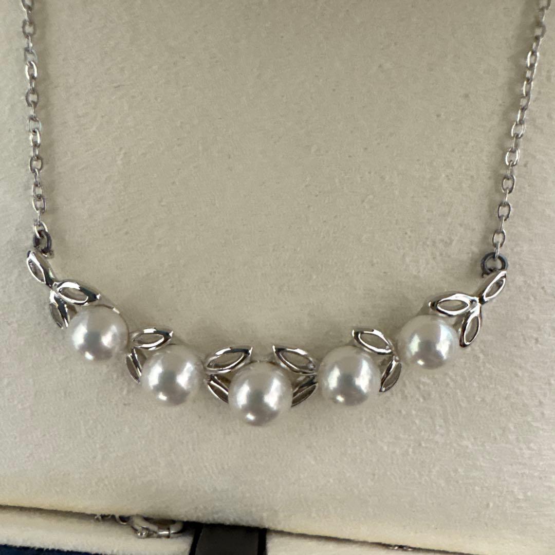 MIKIMOTO Pearl Leaf Motif Necklace featuring pearls and leaf design with chain, displayed with dedicated case