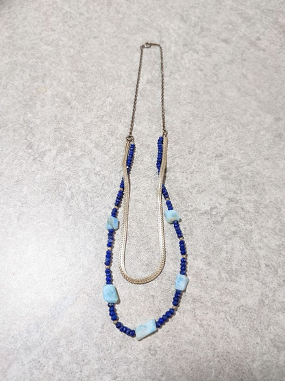 Agete silver double necklace with blue beads featuring a two-strand design, displayed on a white background