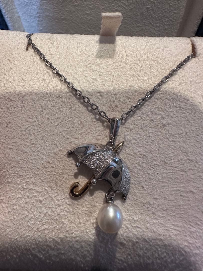 MIKIMOTO umbrella motif pearl necklace made of silver and K18 with pearls, displayed with included case