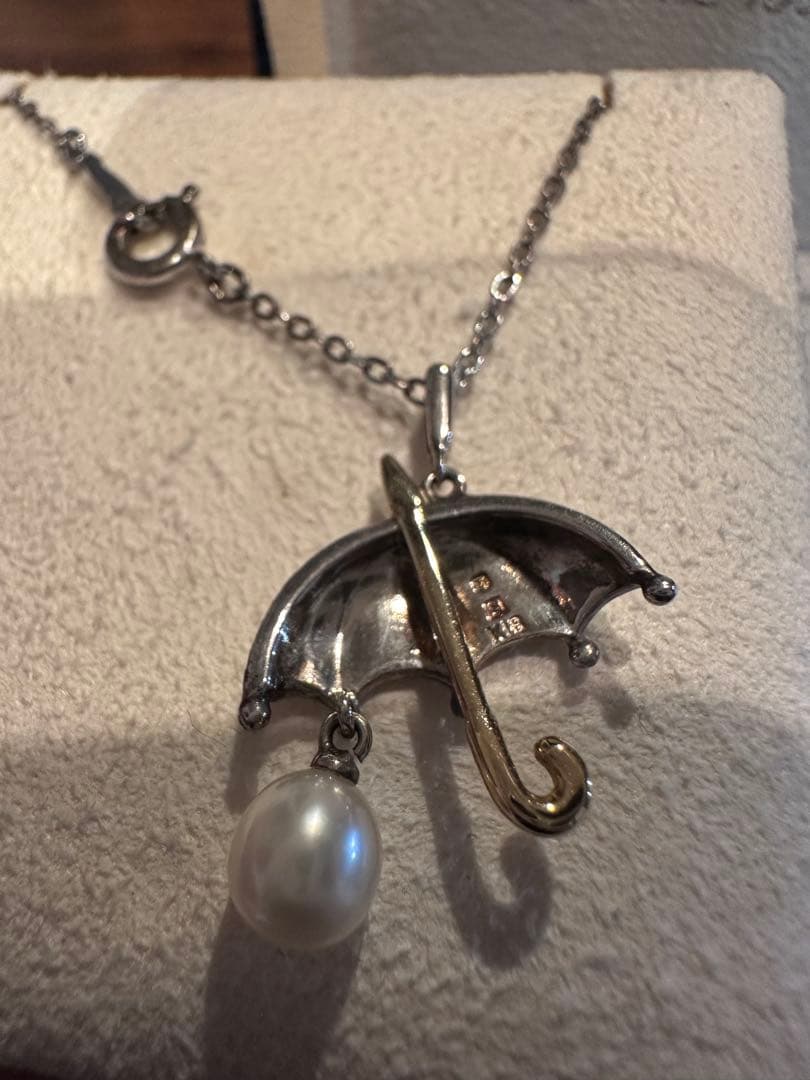 MIKIMOTO umbrella motif pearl necklace made of silver and K18 with pearls, displayed with included case