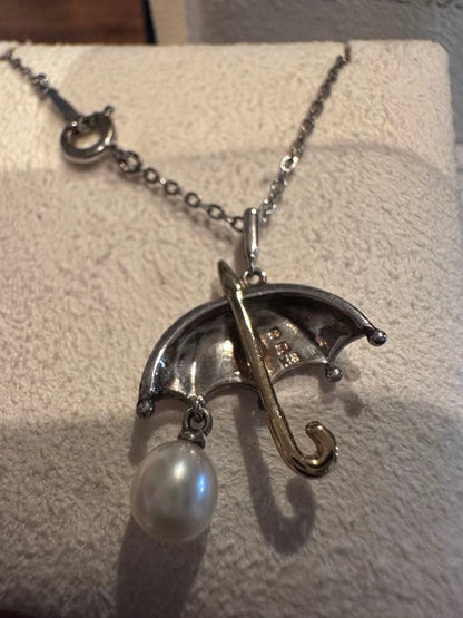 MIKIMOTO umbrella motif pearl necklace made of silver and K18 with pearls, displayed with included case