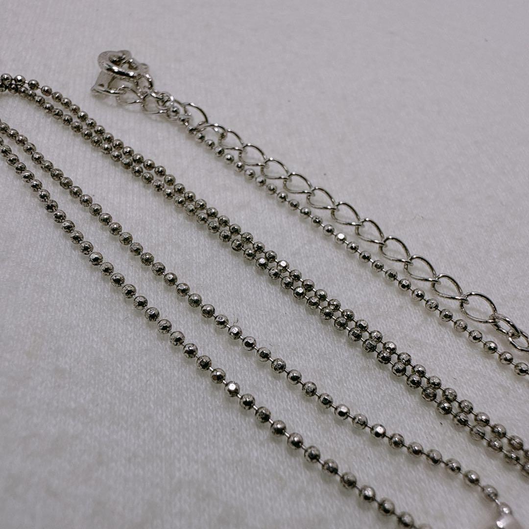 TASAKI silver necklace featuring a single pearl and cross motif with adjustable 39-45 cm chain