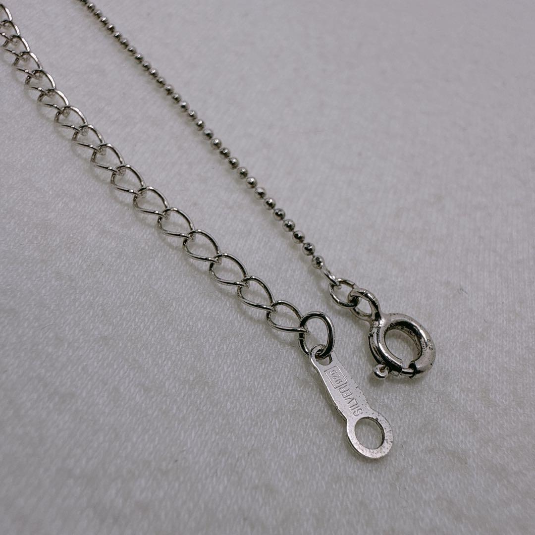 TASAKI silver necklace featuring a single pearl and cross motif with adjustable 39-45 cm chain