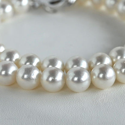 Highest Grade Hanadama Aquamarine Pearl Necklace with 8mm round pearls and silver clasp in cream white with aurora mix color