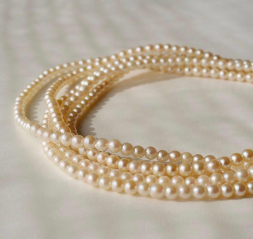 Freshwater Akoya baby pearl necklace 112cm long with small ivory tone pearls and gold plated fittings