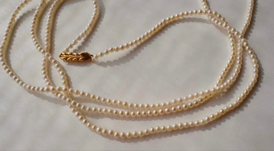 Freshwater Akoya baby pearl necklace 112cm long with small ivory tone pearls and gold plated fittings