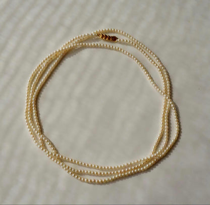 Freshwater Akoya baby pearl necklace 112cm long with small ivory tone pearls and gold plated fittings