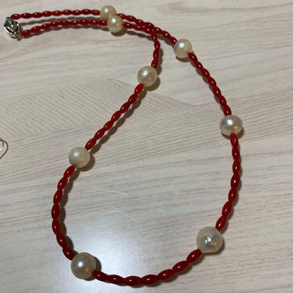 Blood-red coral necklace and matching earrings with 9.5mm Akoya pearls on 48cm chain