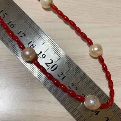 Blood-red coral necklace and matching earrings with 9.5mm Akoya pearls on 48cm chain