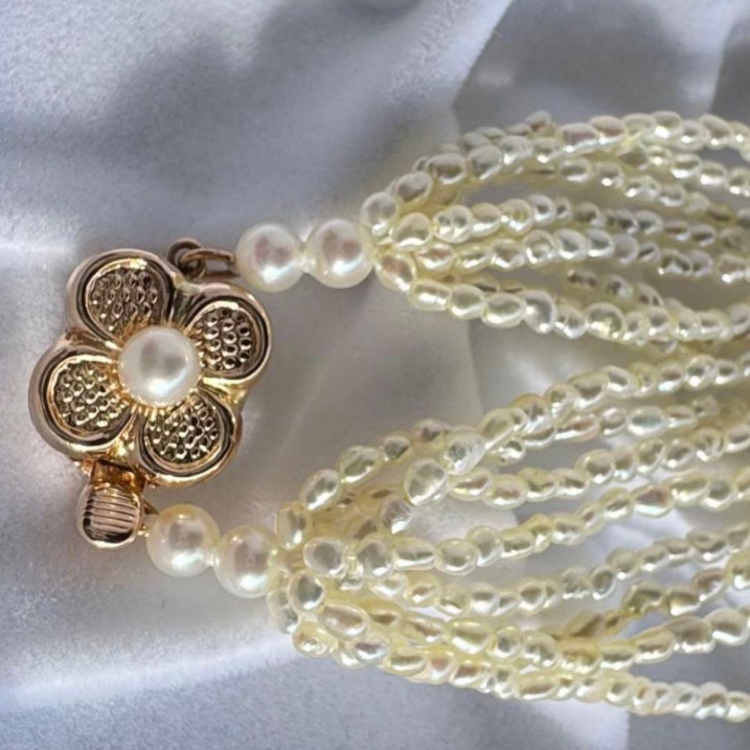 K14 Akoya pearl mugwartless bead necklace with 8 strands and K14 pink gold clasp, 43 cm length