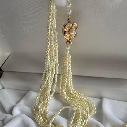 K14 Akoya pearl mugwartless bead necklace with 8 strands and K14 pink gold clasp, 43 cm length