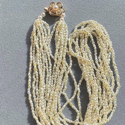 K14 Akoya pearl mugwartless bead necklace with 8 strands and K14 pink gold clasp, 43 cm length
