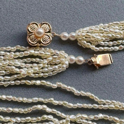 K14 Akoya pearl mugwartless bead necklace with 8 strands and K14 pink gold clasp, 43 cm length