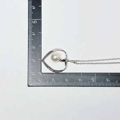 Mikimoto pearl necklace with heart motif featuring 7.1mm pearls on silver chain at 40cm length