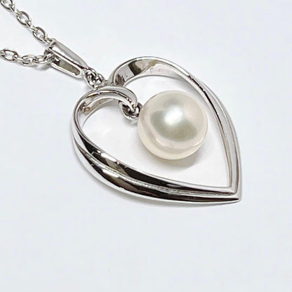 Mikimoto pearl necklace with heart motif featuring 7.1mm pearls on silver chain at 40cm length
