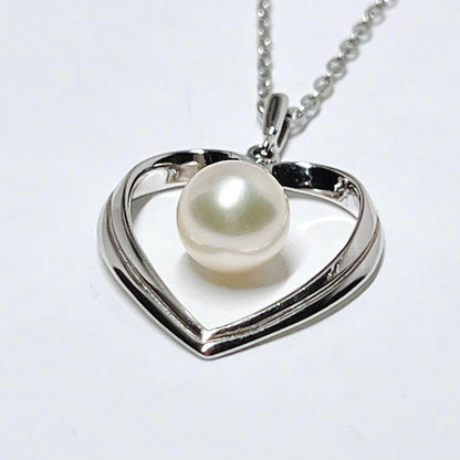 Mikimoto pearl necklace with heart motif featuring 7.1mm pearls on silver chain at 40cm length