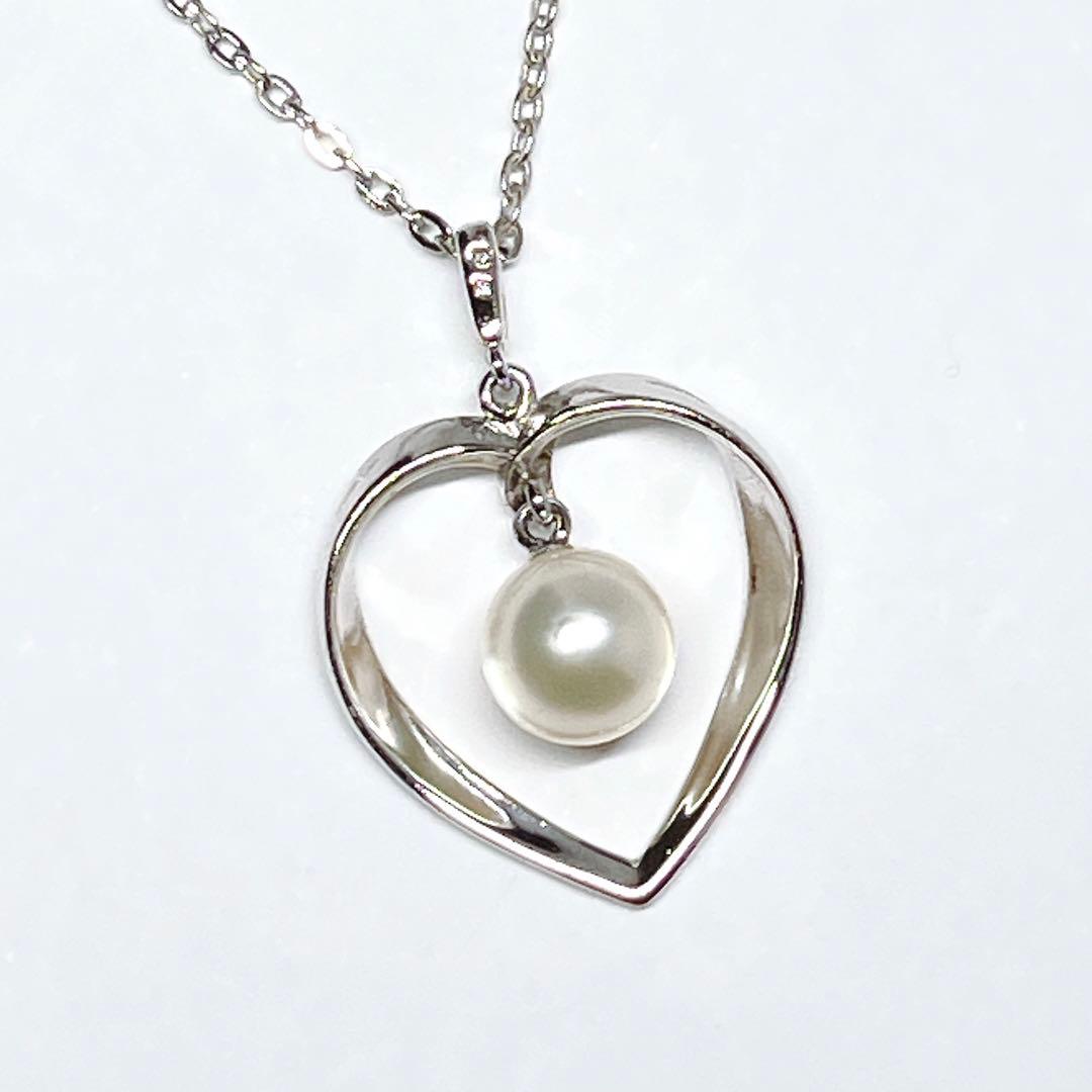 Mikimoto pearl necklace with heart motif featuring 7.1mm pearls on silver chain at 40cm length