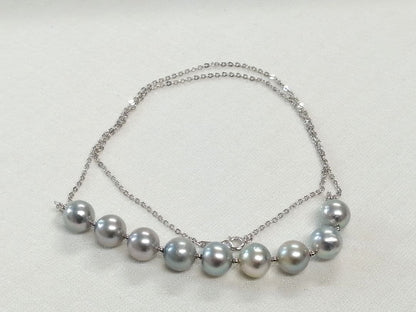 Akoya pearl gray necklace set with nine round gray pearls and a 49 cm silver chain