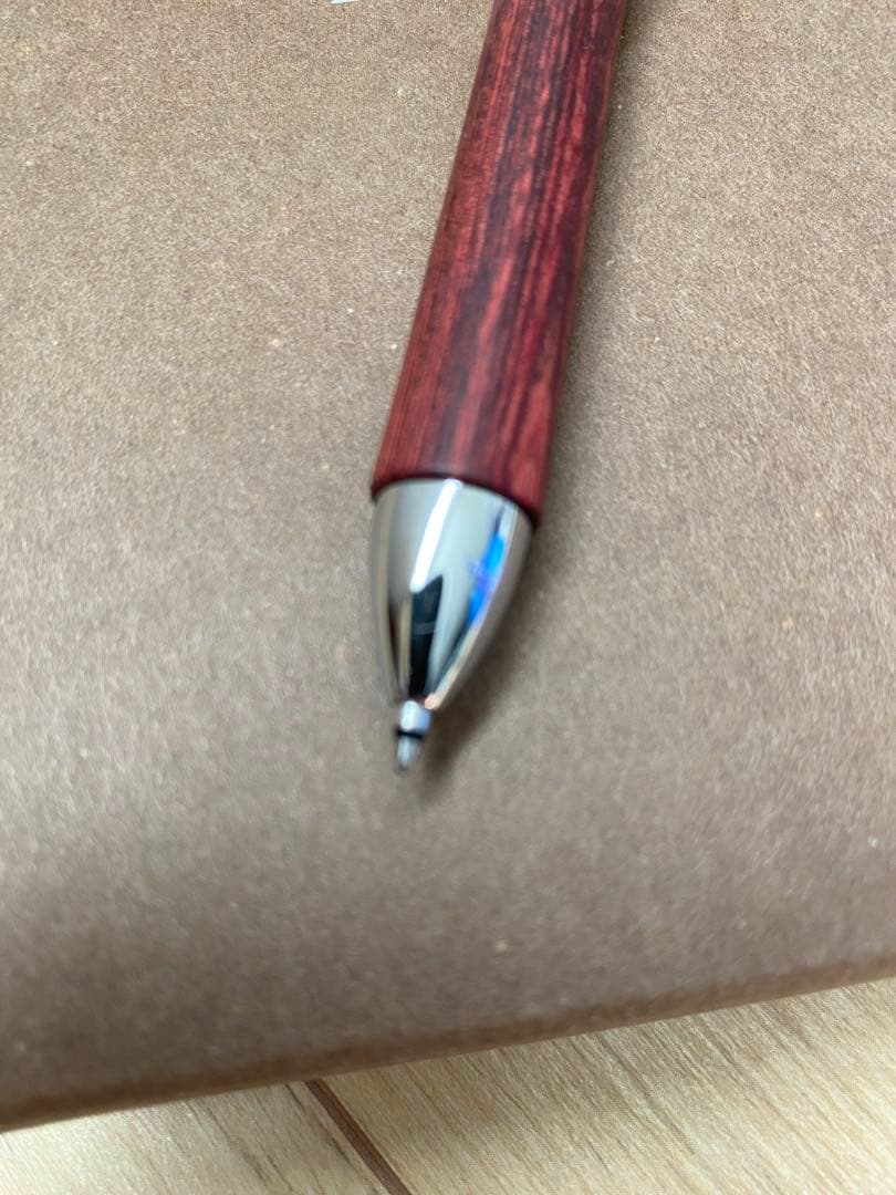 Pilot 3-color ballpoint pen showing red, blue, and black ink with included pen case