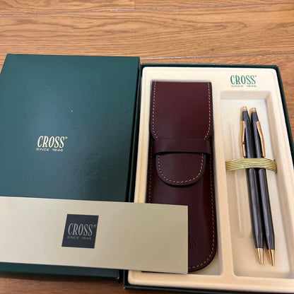 Cross ballpoint pen and mechanical pencil set with matching pen case on white background