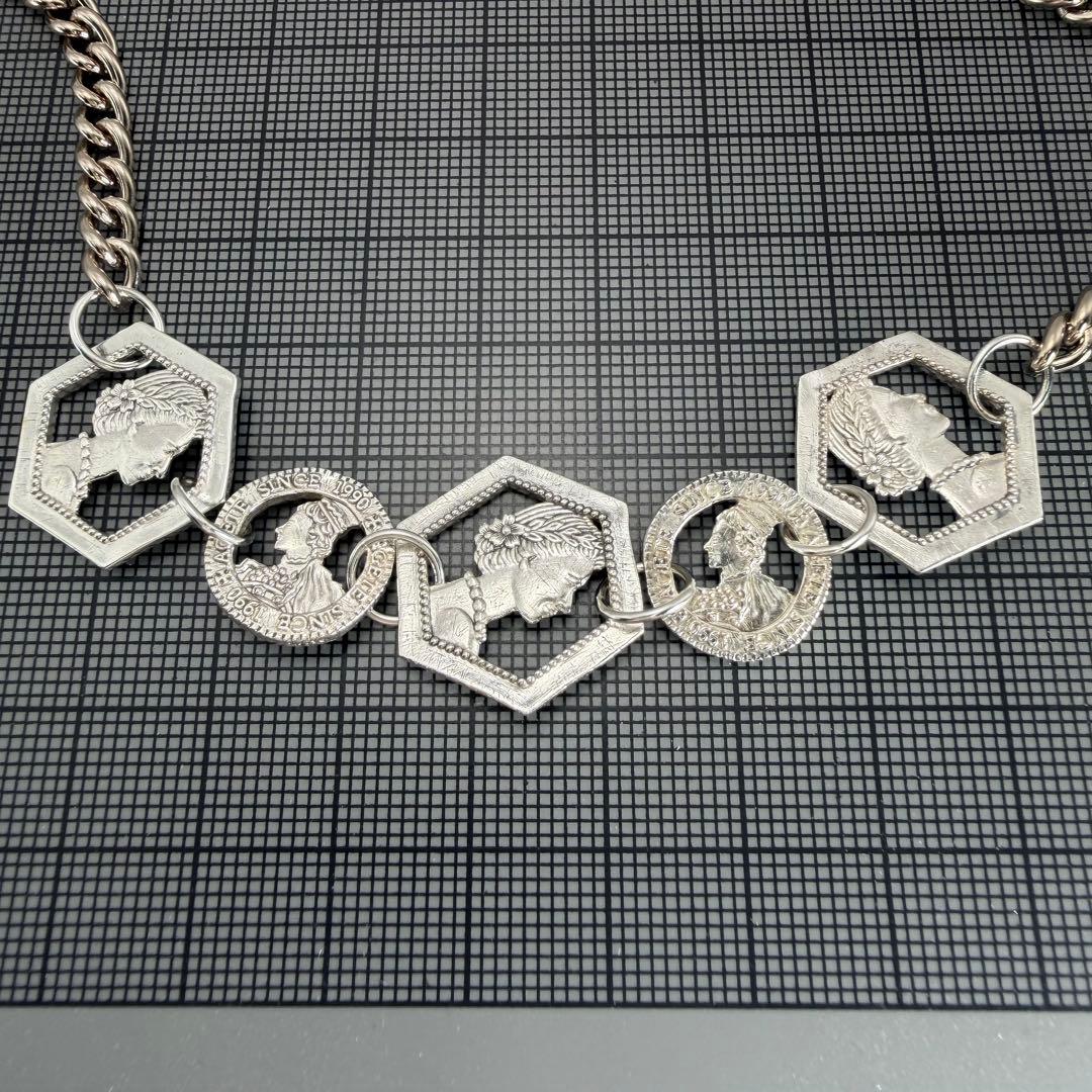Silver plated Agat Coin Motif Necklace with a 49.5 cm length displayed on a white background
