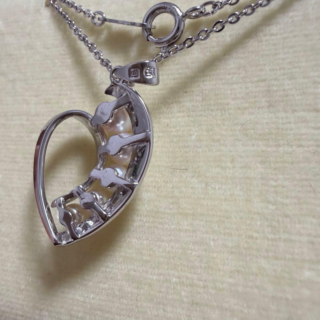 Mikimoto heart-shaped pearl pendant necklace featuring five pearls with silver decoration and included box