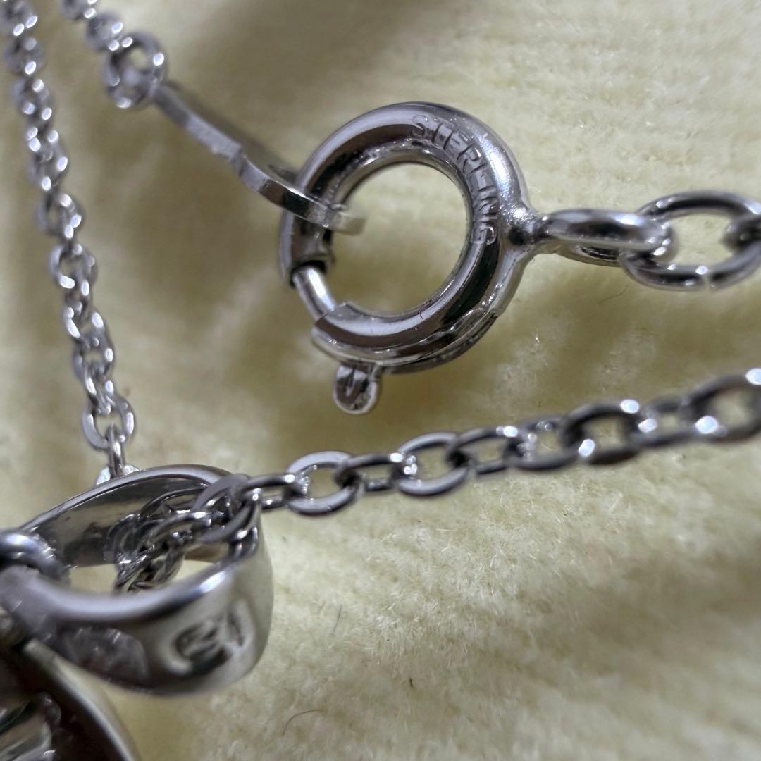 Mikimoto heart-shaped pearl pendant necklace featuring five pearls with silver decoration and included box