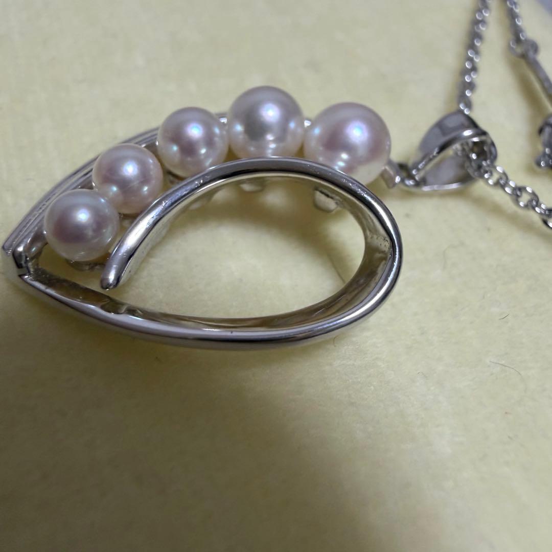 Mikimoto heart-shaped pearl pendant necklace featuring five pearls with silver decoration and included box