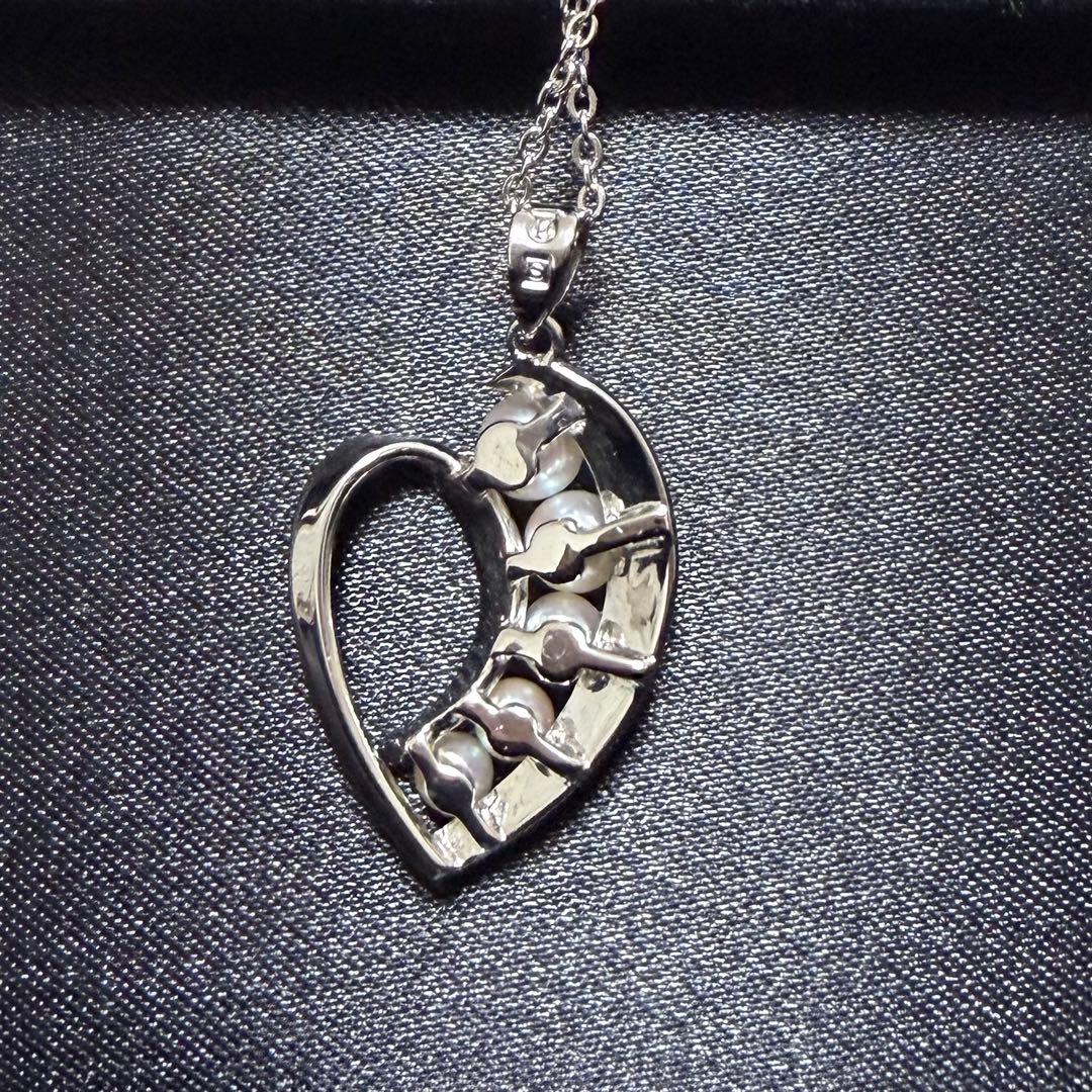 Mikimoto heart-shaped pearl pendant necklace featuring five pearls with silver decoration and included box