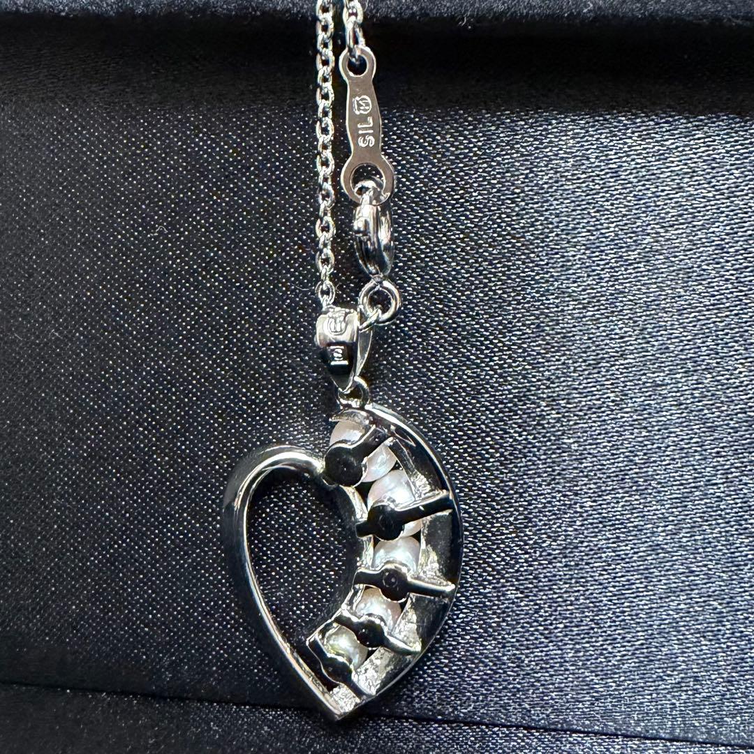 Mikimoto heart-shaped pearl pendant necklace featuring five pearls with silver decoration and included box