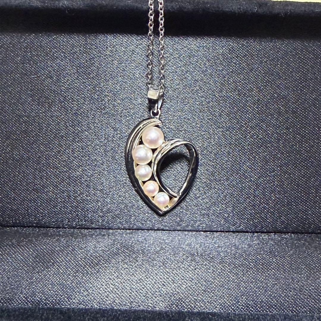 Mikimoto heart-shaped pearl pendant necklace featuring five pearls with silver decoration and included box
