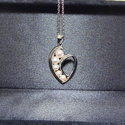 Mikimoto heart-shaped pearl pendant necklace featuring five pearls with silver decoration and included box