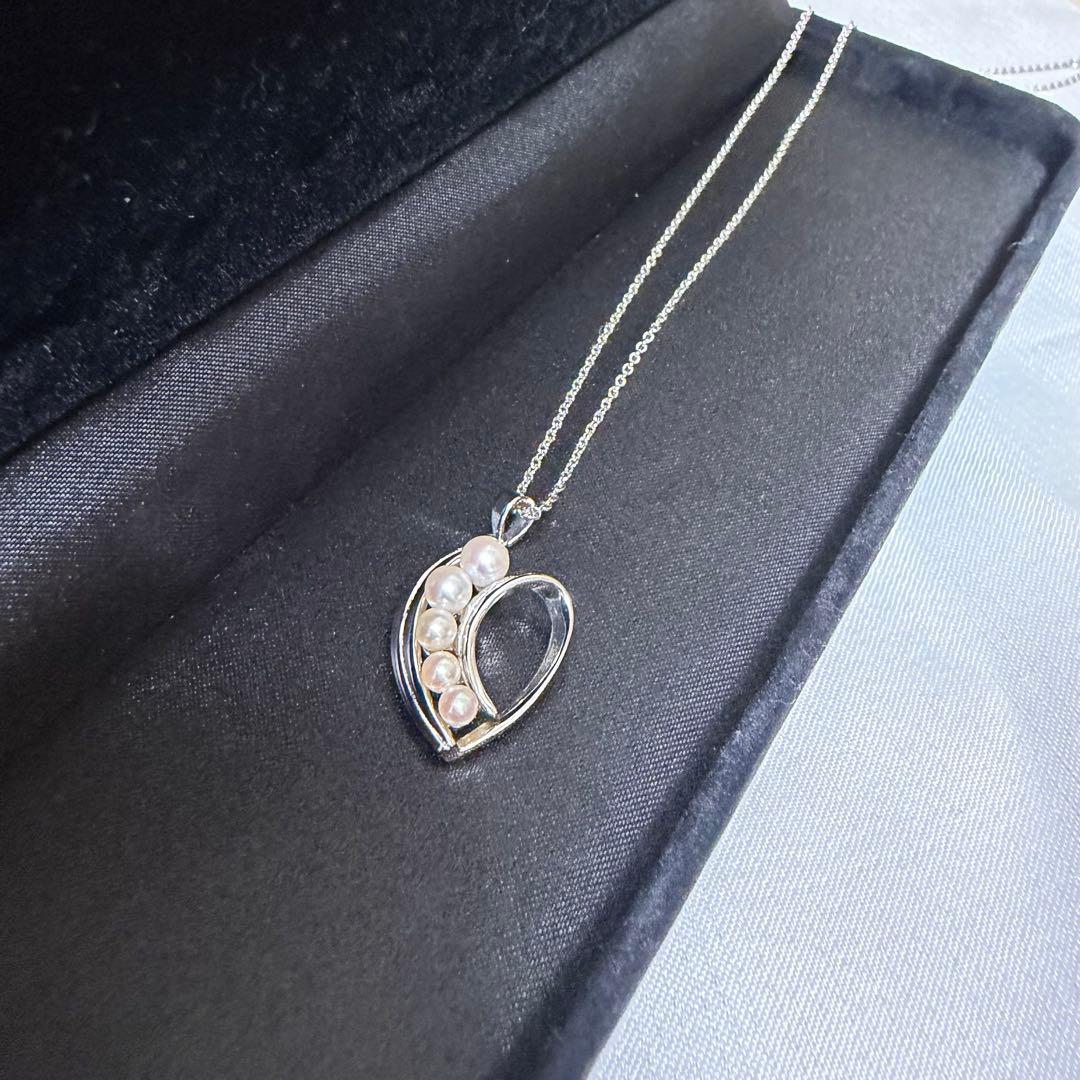 Mikimoto heart-shaped pearl pendant necklace featuring five pearls with silver decoration and included box