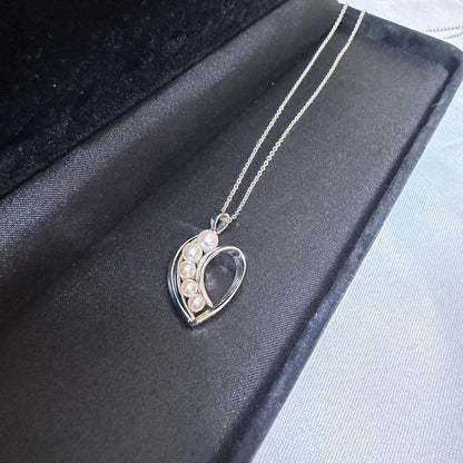 Mikimoto heart-shaped pearl pendant necklace featuring five pearls with silver decoration and included box