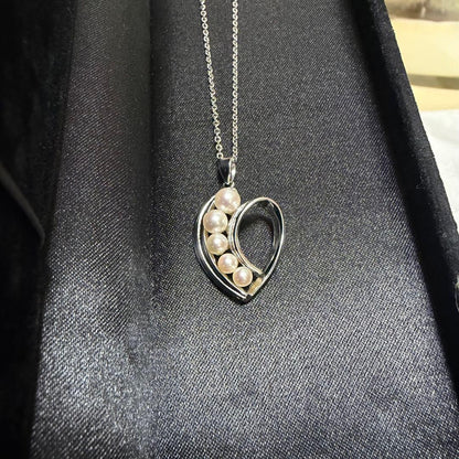 Mikimoto heart-shaped pearl pendant necklace featuring five pearls with silver decoration and included box