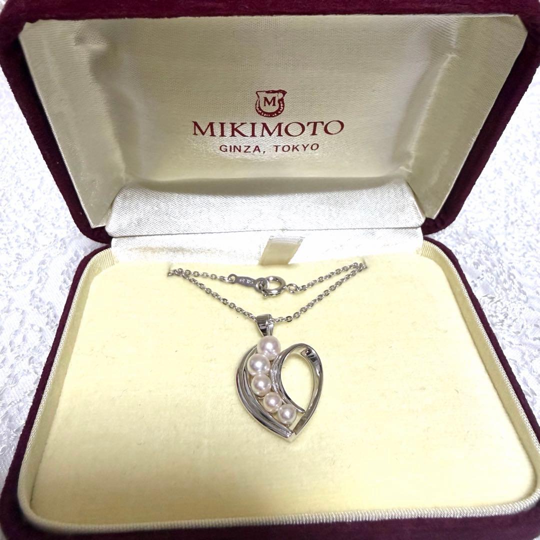 Mikimoto heart-shaped pearl pendant necklace featuring five pearls with silver decoration and included box