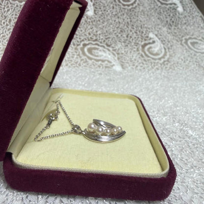 Mikimoto heart-shaped pearl pendant necklace featuring five pearls with silver decoration and included box