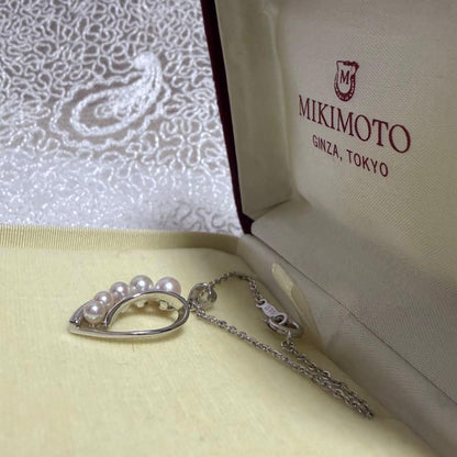 Mikimoto heart-shaped pearl pendant necklace featuring five pearls with silver decoration and included box