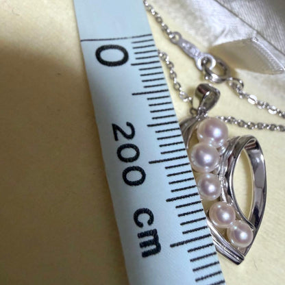 Mikimoto heart-shaped pearl pendant necklace featuring five pearls with silver decoration and included box