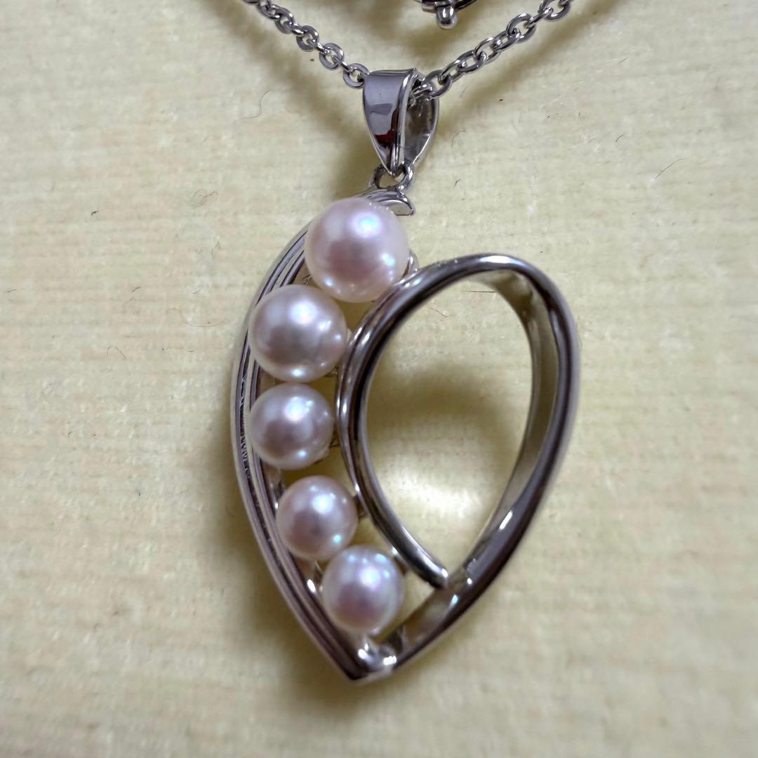 Mikimoto heart-shaped pearl pendant necklace featuring five pearls with silver decoration and included box