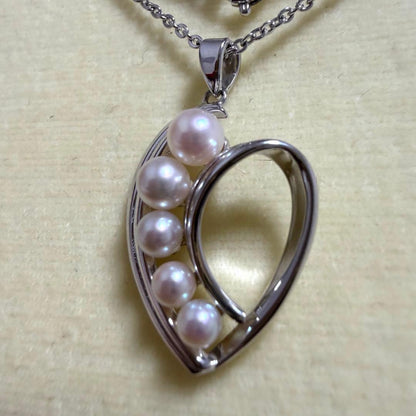 Mikimoto heart-shaped pearl pendant necklace featuring five pearls with silver decoration and included box