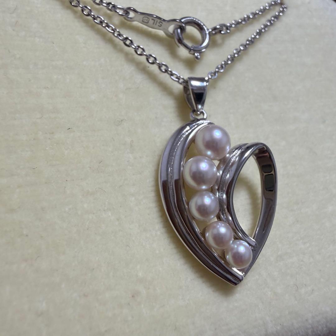 Mikimoto heart-shaped pearl pendant necklace featuring five pearls with silver decoration and included box