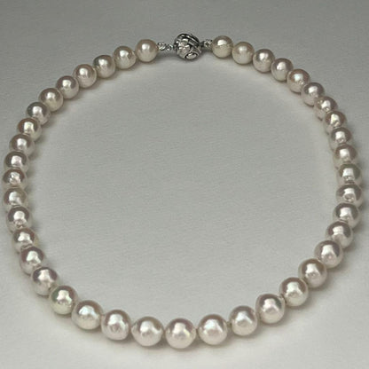 Akoya pearl necklace with 9.0-9.5mm white semi-round pearls and silver engraved round clasp, 42cm length